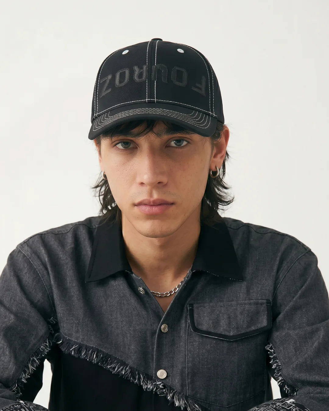 Black Street Typography Cap – FOUROZ unisex black cap – on model