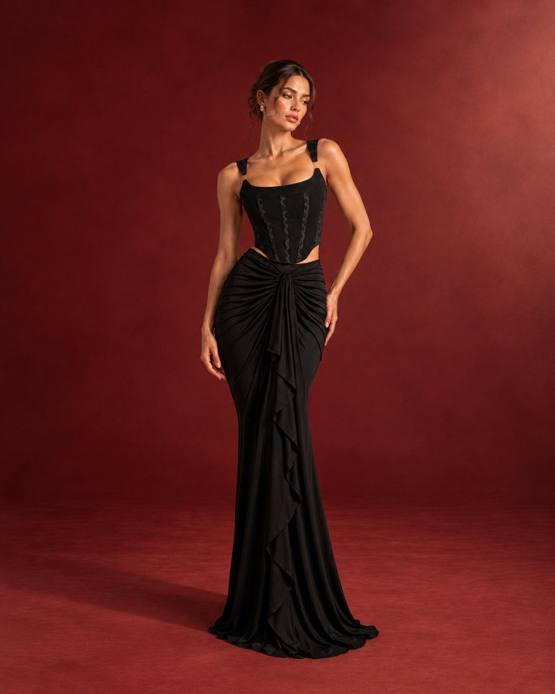 Woman in a black corset and draped skirt