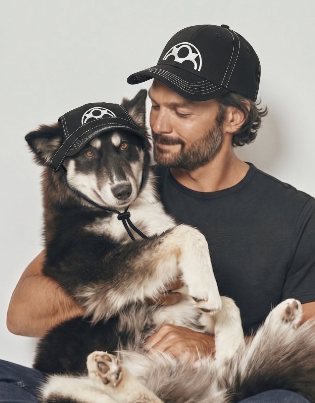 Man and dog in matching Fouroz caps